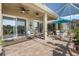 Relax in the spacious lanai featuring ceiling fans and comfortable seating, offering a serene outdoor retreat at 1110 Jasmine Creek Ct, Sun City Center, FL 33573