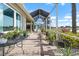 The extended screened lanai offers ample space for relaxation and enjoying the outdoors with a serene lake view at 1110 Jasmine Creek Ct, Sun City Center, FL 33573