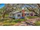 Single-story home with a brick chimney, situated on a spacious lot, offering potential for outdoor enjoyment at 11912 Mcmullen Loop, Riverview, FL 33569
