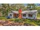 Charming single-story home with a brick chimney and inviting front yard, exuding curb appeal at 11912 Mcmullen Loop, Riverview, FL 33569