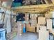 Interior view of a storage shed filled with boxes and household items, ready for organizing and decluttering at 11912 Mcmullen Loop, Riverview, FL 33569