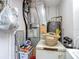 Utility room with water heater, HVAC system, a refrigerator, and some storage at 11912 Mcmullen Loop, Riverview, FL 33569