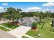 A beautiful single-Gathering home boasts meticulous landscaping, a well-maintained lawn, and a spacious three-car garage at 120 Fernbrook Rd, Oldsmar, FL 34677