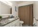 Full bathroom featuring granite counters, neutral paint, standard tile, and a shower/tub combo with curtain at 120 Fernbrook Rd, Oldsmar, FL 34677