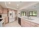 Bright kitchen with white appliances, tile flooring and adjacent breakfast nook at 120 Fernbrook Rd, Oldsmar, FL 34677