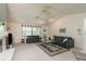 Comfortable living room with vaulted ceiling and large windows at 120 Fernbrook Rd, Oldsmar, FL 34677