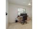 A home office featuring neutral carpet, natural light, a standard closet and a black rolling computer chair at 120 Fernbrook Rd, Oldsmar, FL 34677