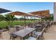 Inviting outdoor patio with comfortable seating, umbrellas, and scenic views of the lush golf course at 120 Fernbrook Rd, Oldsmar, FL 34677