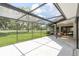 The screened-in patio provides ample space for outdoor entertainment with golf course views at 120 Fernbrook Rd, Oldsmar, FL 34677