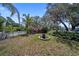 Lush backyard featuring a fire pit perfect for entertaining under a clear sky at 12304 Woodleigh Ave, Tampa, FL 33612