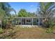 Charming single-story home with a well-maintained lawn and inviting front porch at 12304 Woodleigh Ave, Tampa, FL 33612