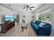 Inviting living room featuring modern decor, a sleek TV, and a comfortable sofa at 12304 Woodleigh Ave, Tampa, FL 33612