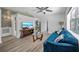Cozy living room featuring modern decor, a sleek TV, and a comfortable blue sofa at 12304 Woodleigh Ave, Tampa, FL 33612