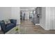 Open-concept floor plan with the living room looking into the modern kitchen at 12304 Woodleigh Ave, Tampa, FL 33612