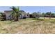 Backyard view showcasing a pool and verdant greenery at 1242 Bermuda St, Clearwater, FL 33755