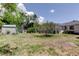 Lush backyard with storage shed and AC unit at 1242 Bermuda St, Clearwater, FL 33755