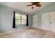 Bright bedroom features a ceiling fan and a window, creating a cozy and airy space at 1242 Bermuda St, Clearwater, FL 33755