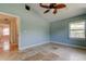 Spacious bedroom featuring a modern ceiling fan, neutral walls and tile floors at 1242 Bermuda St, Clearwater, FL 33755