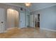 Bedroom features light gray walls, tile flooring, and an arched alcove for decor at 1242 Bermuda St, Clearwater, FL 33755