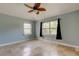 Cozy bedroom with bright natural light and a ceiling fan for added comfort at 1242 Bermuda St, Clearwater, FL 33755