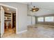 Bedroom featuring an attached bathroom, tile floors, and ceiling fan at 1242 Bermuda St, Clearwater, FL 33755