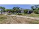 A quaint single-story house with an established front yard and concrete sidewalk in a residential neighborhood at 1242 Bermuda St, Clearwater, FL 33755