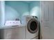 Bright laundry room includes a Hotpoint washing machine and Samsung dryer at 1242 Bermuda St, Clearwater, FL 33755