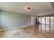 Spacious living room featuring tile flooring, neutral-toned walls, and sliding glass doors to extend the living space at 1242 Bermuda St, Clearwater, FL 33755