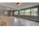Bright, airy living room with decorative lighting, neutral paint, and expansive windows providing natural light at 1242 Bermuda St, Clearwater, FL 33755