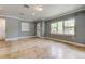 Bright living room features neutral walls, tile floors, and large windows that offer a pleasant view of the outdoors at 1242 Bermuda St, Clearwater, FL 33755