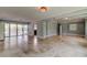Open-concept living room with tile flooring, sliding glass doors, and neutral paint, ideal for easy living and entertaining at 1242 Bermuda St, Clearwater, FL 33755