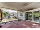 Covered patio leads to the backyard and features sliding glass doors into the home at 1242 Bermuda St, Clearwater, FL 33755