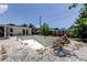 View of empty inground pool with paver decking and access to lanai at 1242 Bermuda St, Clearwater, FL 33755