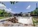 Empty inground pool is surrounded by brick pavers and landscaping at 1242 Bermuda St, Clearwater, FL 33755