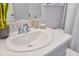 Bright bathroom featuring a sleek white sink, quartz countertop, and modern chrome faucet at 12435 Gust Ct, Hudson, FL 34669