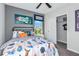 Cozy bedroom decorated with playful, space-themed decor and featuring a closet and bright window at 12435 Gust Ct, Hudson, FL 34669