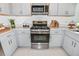Well-equipped kitchen with stainless steel appliances, quartz countertops, and modern cabinetry at 12435 Gust Ct, Hudson, FL 34669