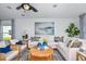 Cozy living room offers a plush sofa, stylish decor, and ample natural light at 12435 Gust Ct, Hudson, FL 34669