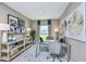 Home office featuring a comfortable desk, stylish decor, and ample natural light at 12435 Gust Ct, Hudson, FL 34669