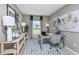 Home office featuring a comfortable desk, stylish decor, and ample natural light at 12435 Gust Ct, Hudson, FL 34669