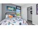 Cozy bedroom featuring a rocketship motif, window, and closet at 12469 Gust Ct, Hudson, FL 34669