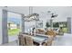Inviting dining area open to the living space, featuring modern decor and natural light, ideal for entertaining at 12469 Gust Ct, Hudson, FL 34669