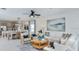 Open-concept living space featuring modern decor, with a seating area, creating a comfortable environment for gatherings at 12469 Gust Ct, Hudson, FL 34669