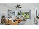Inviting living room featuring contemporary furniture, stylish decor, and a large window offering scenic views at 12469 Gust Ct, Hudson, FL 34669