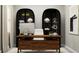 Modern home office featuring a wooden desk, comfortable chair, and stylish decor at 12597 Lily Quartz Loop, Parrish, FL 34219