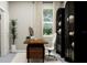 Bright and airy home office with a large window, stylish decor, and a comfortable workspace at 12597 Lily Quartz Loop, Parrish, FL 34219