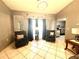 Inviting living room with tile flooring, comfortable seating, and plenty of natural light at 13100 Serpentine Dr, Hudson, FL 34667