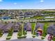 Aerial view of a beautiful home surrounded by a lush landscape in a serene neighborhood at 1321 Custer Bayou St, Ruskin, FL 33570