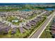 Aerial view of a Primary-planned community showing the property's location near a community pool and scenic ponds at 1321 Custer Bayou St, Ruskin, FL 33570
