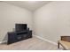 Bonus room featuring a television, a television stand, light colored walls, and a chair with ornate design at 1321 Custer Bayou St, Ruskin, FL 33570